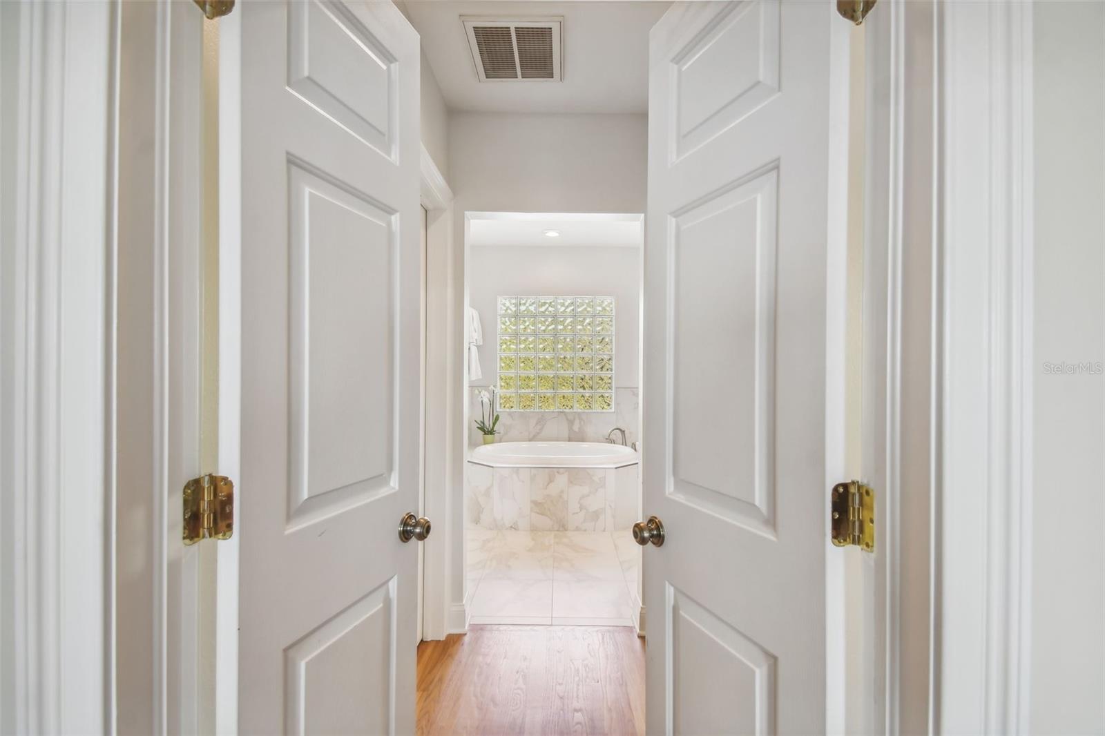 Double Doors to the En Suite Bath from the Master Bedroom