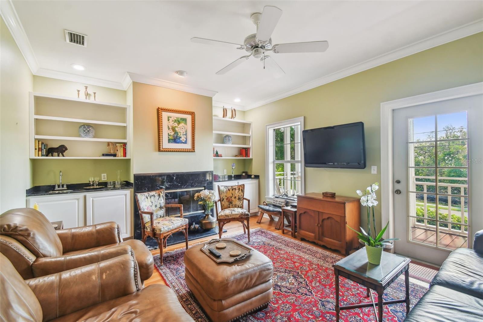 Double Doors into Living Room - please note the fireplace and Wet Bar!