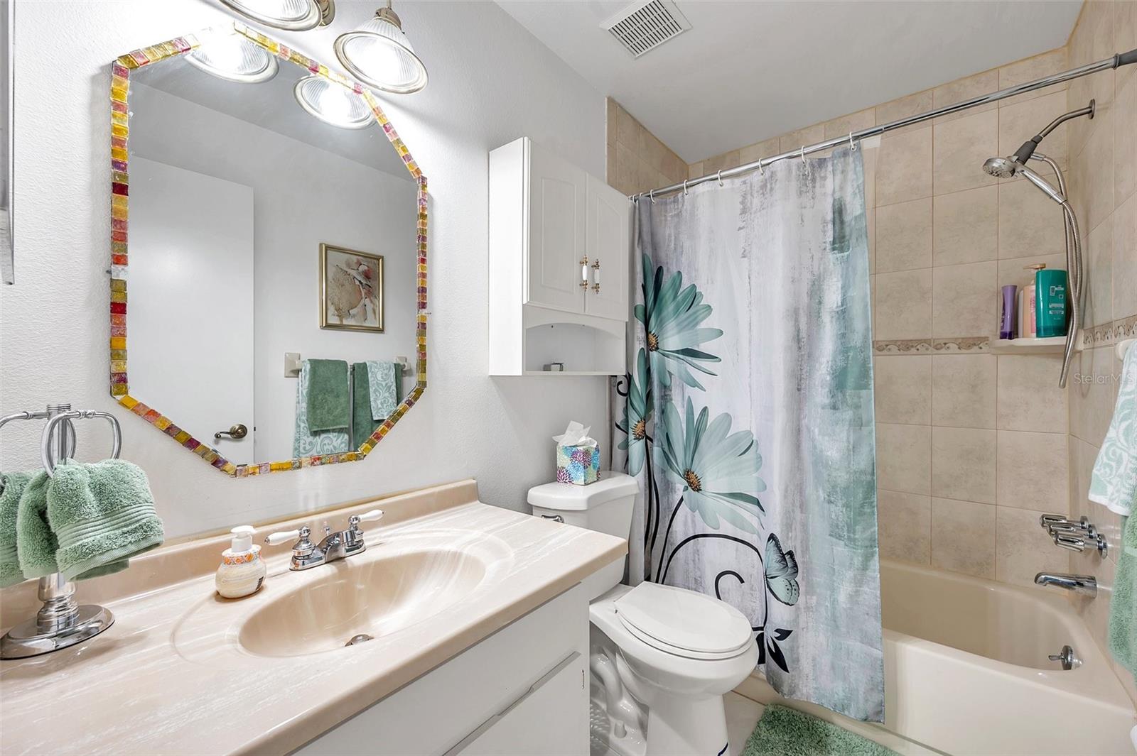 Guest bathroom with tub l