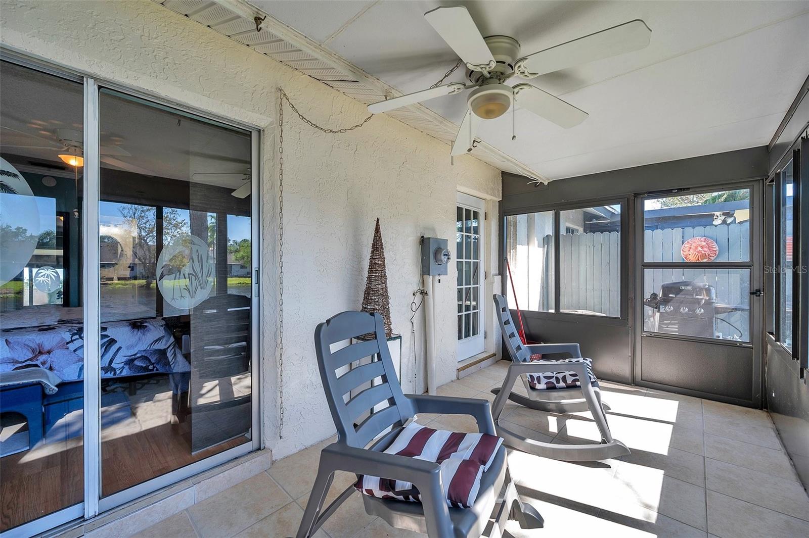 Back porch overlooks the sparkling pond. Relax & enjoy!