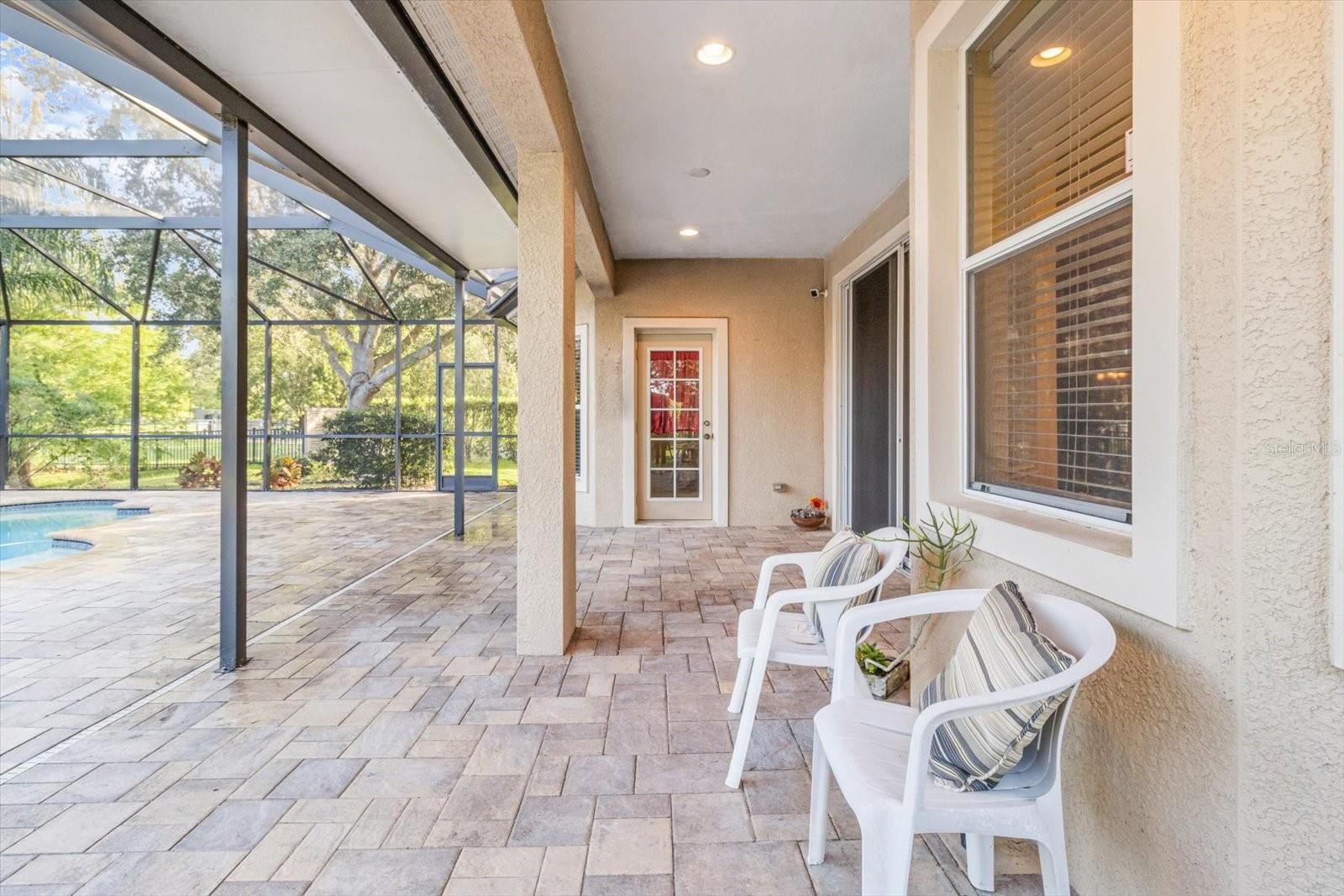 Brick Patio Offers Ample Shelter Under Extended Overhang