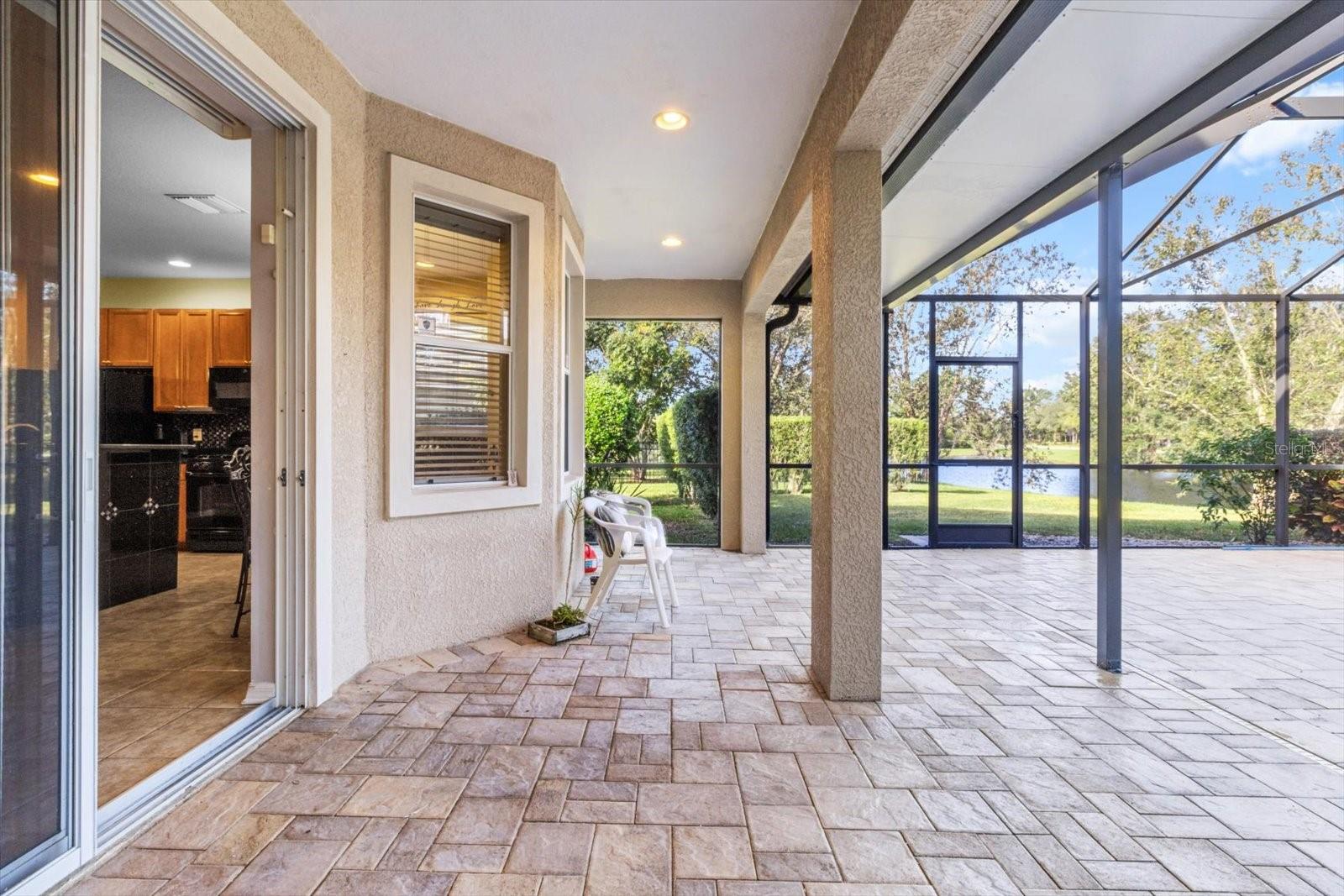 Brick Patio Offers Ample Shelter Under Extended Overhang