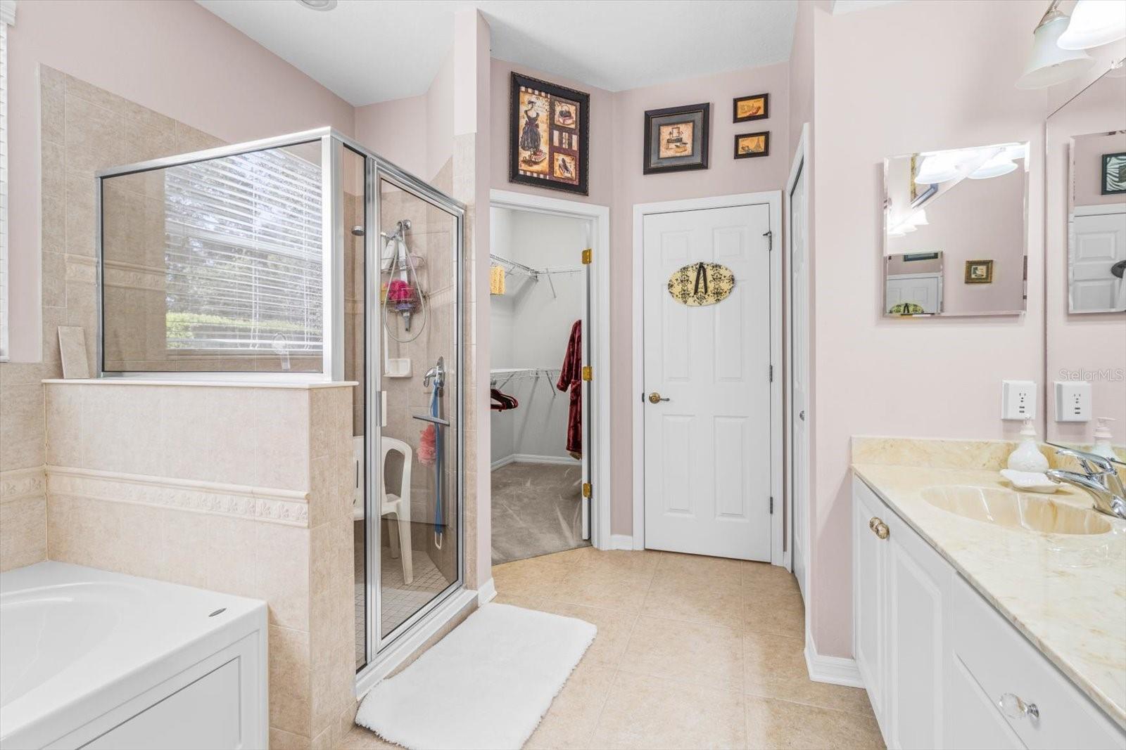 Master Bath includes secluded Water Closet, Garden/Jetted Tub; Large Walk In Shower; Dual Sinks, Access to Master Walk In Closet