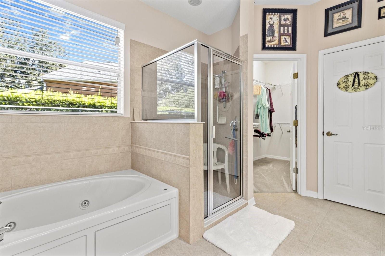 Master Bath includes secluded Water Closet, Garden/Jetted Tub; Large Walk In Shower; Dual Sinks, Access to Master Walk In Closet