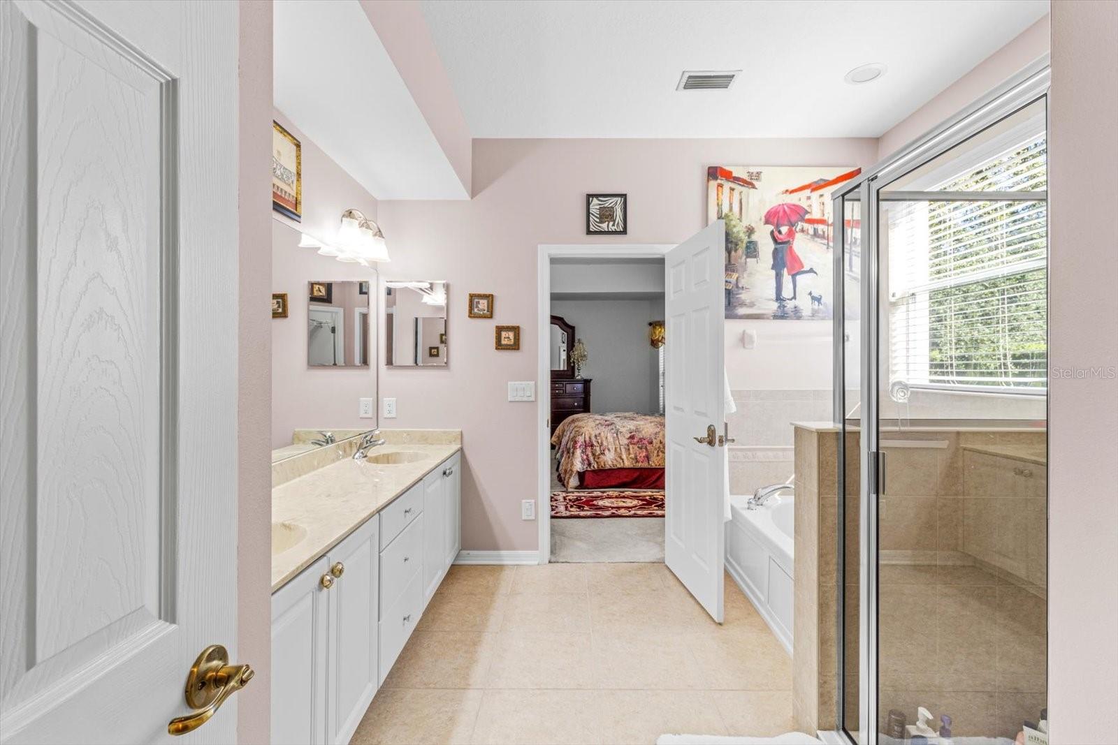 Master Bath includes secluded Water Closet, Garden/Jetted Tub; Large Walk In Shower; Dual Sinks, Access to Master Walk In Closet