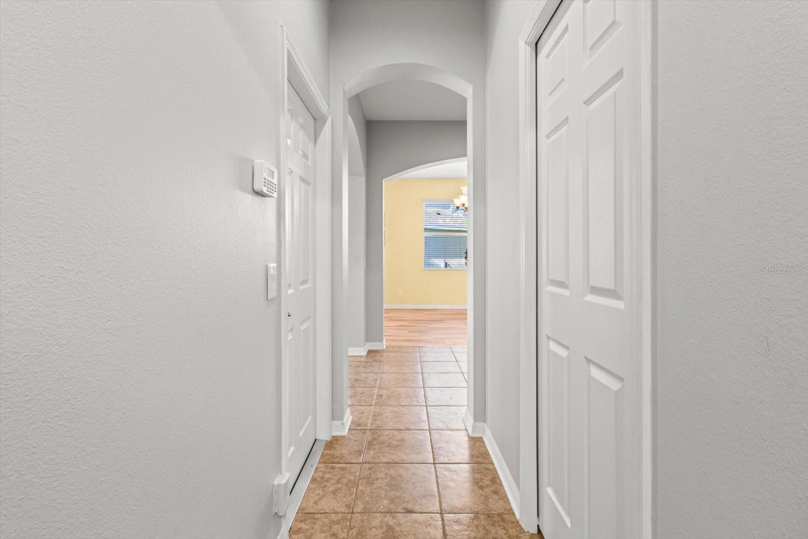 Downstairs Hallway from Garage Leading to Laundry Room and Main Floor Half Bath