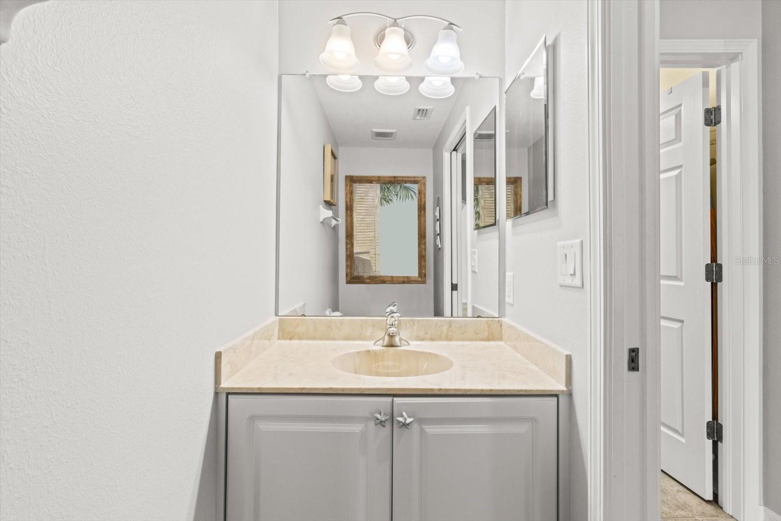 Half Bath/Powder room Located on Main Floor near Garage and Laundry Room