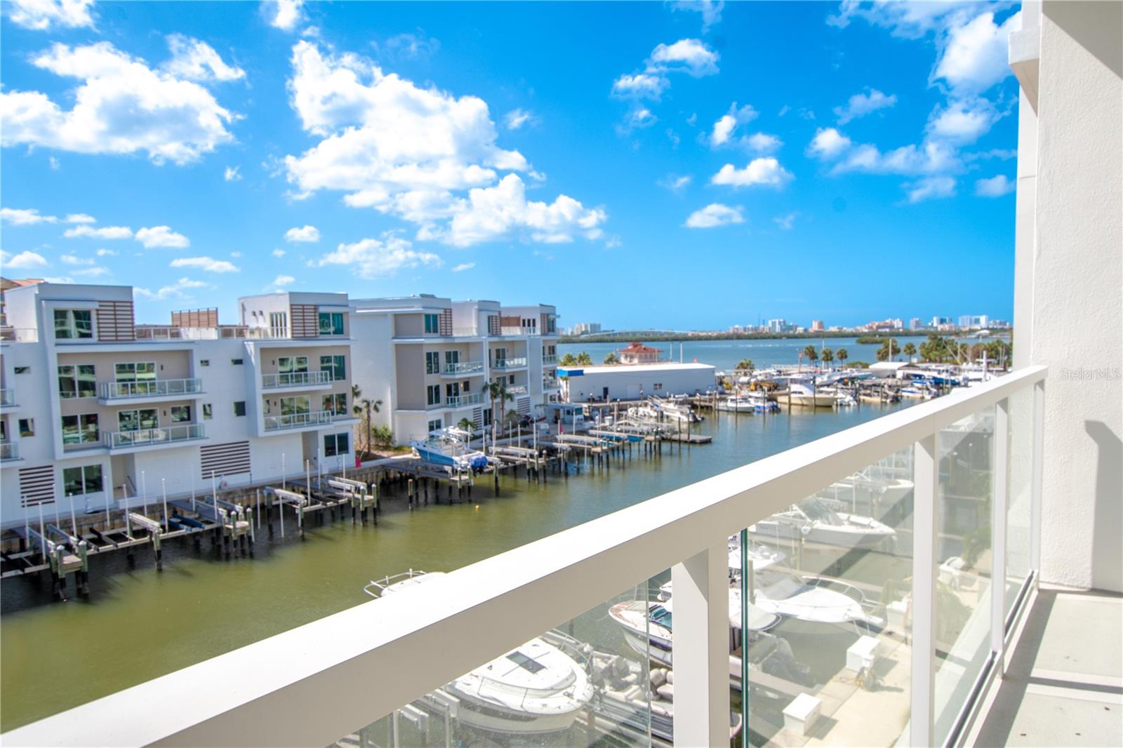 A large balcony with views of the marina and intercoastal waterway.