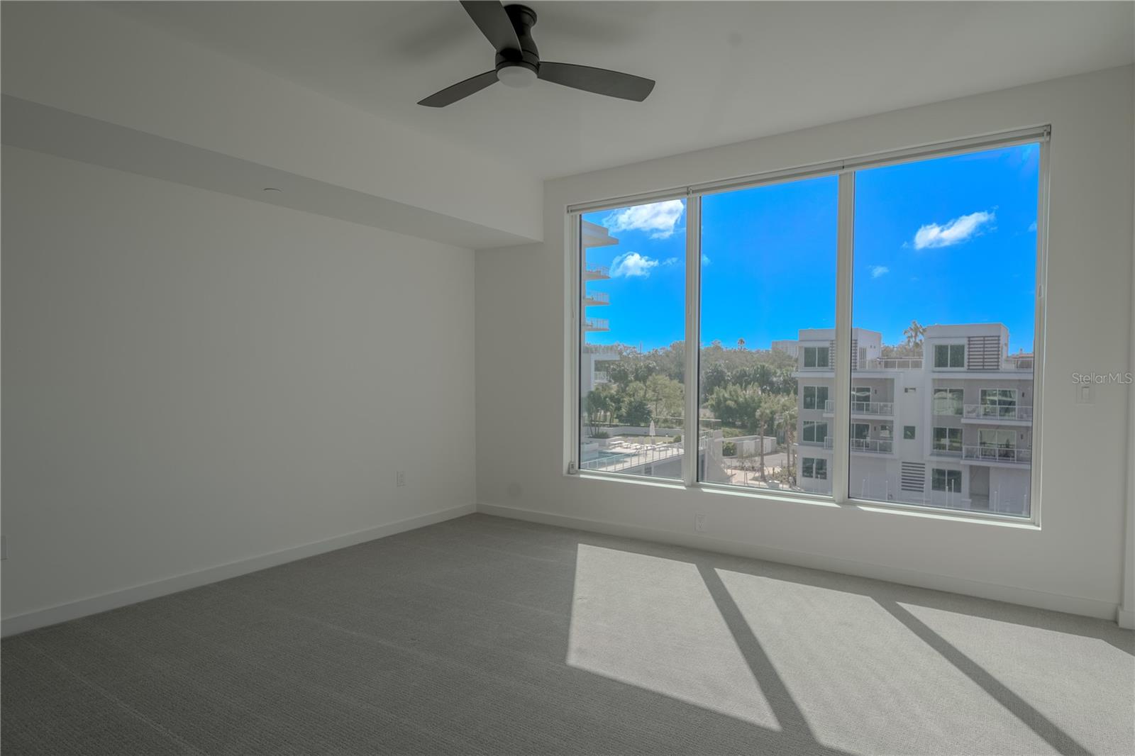 The 2nd bedroom features a picture window with electric blinds.