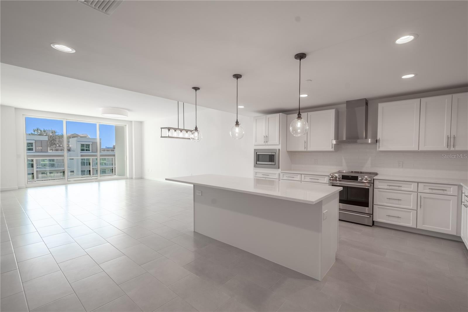 A modern Kitchen with a suite of stainless steel Cafe appliances