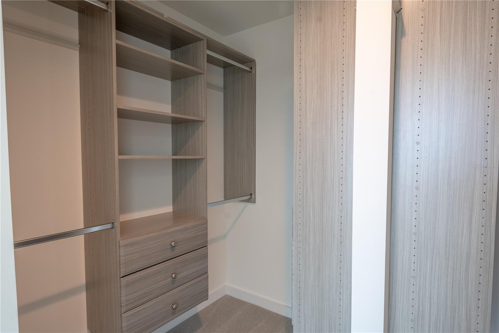 The primary bedroom walk-in closet.