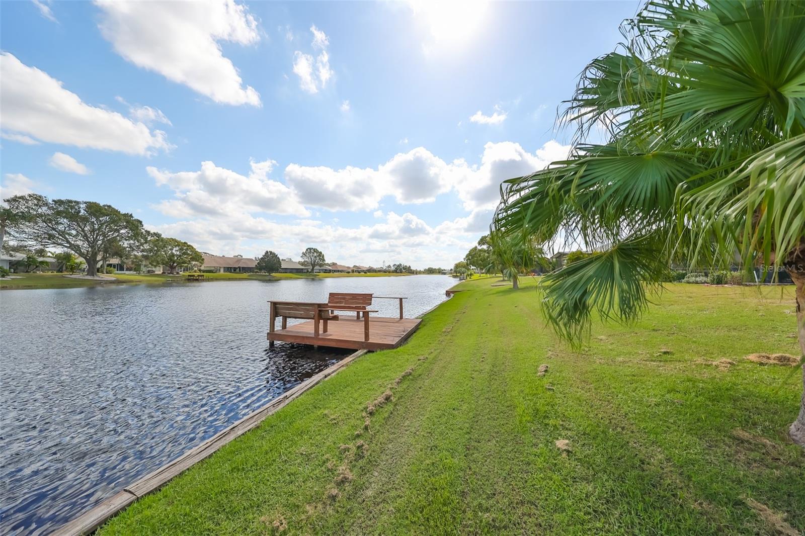 Rear Yard w/ Lovely Pond View & Recently Painted Private Dock