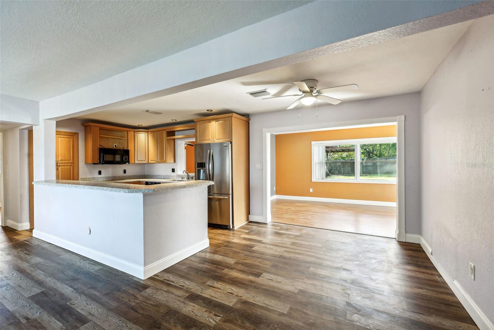 looking from living room to dining and bonus room