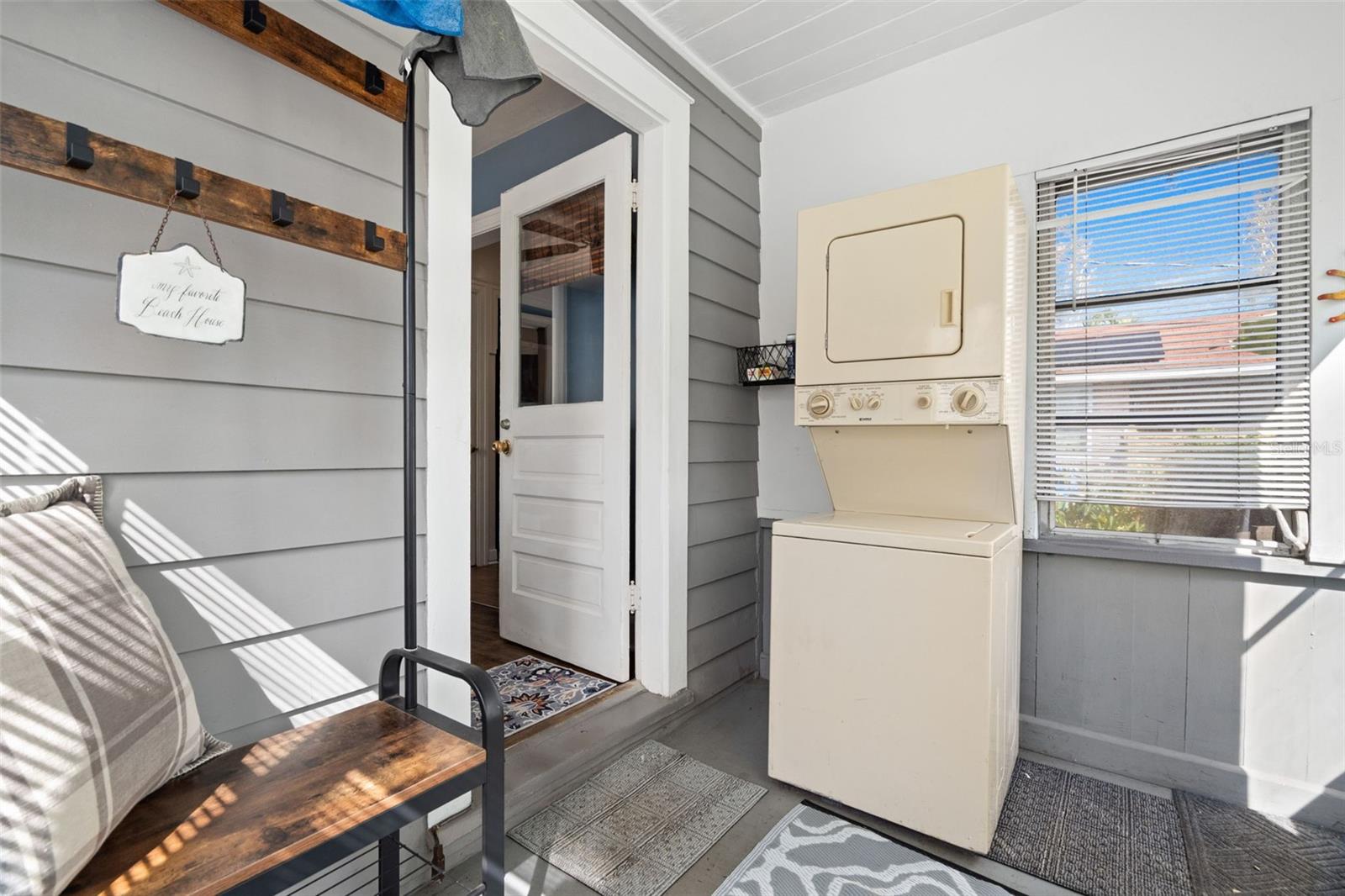 Enclosed back porch with washer and dryer