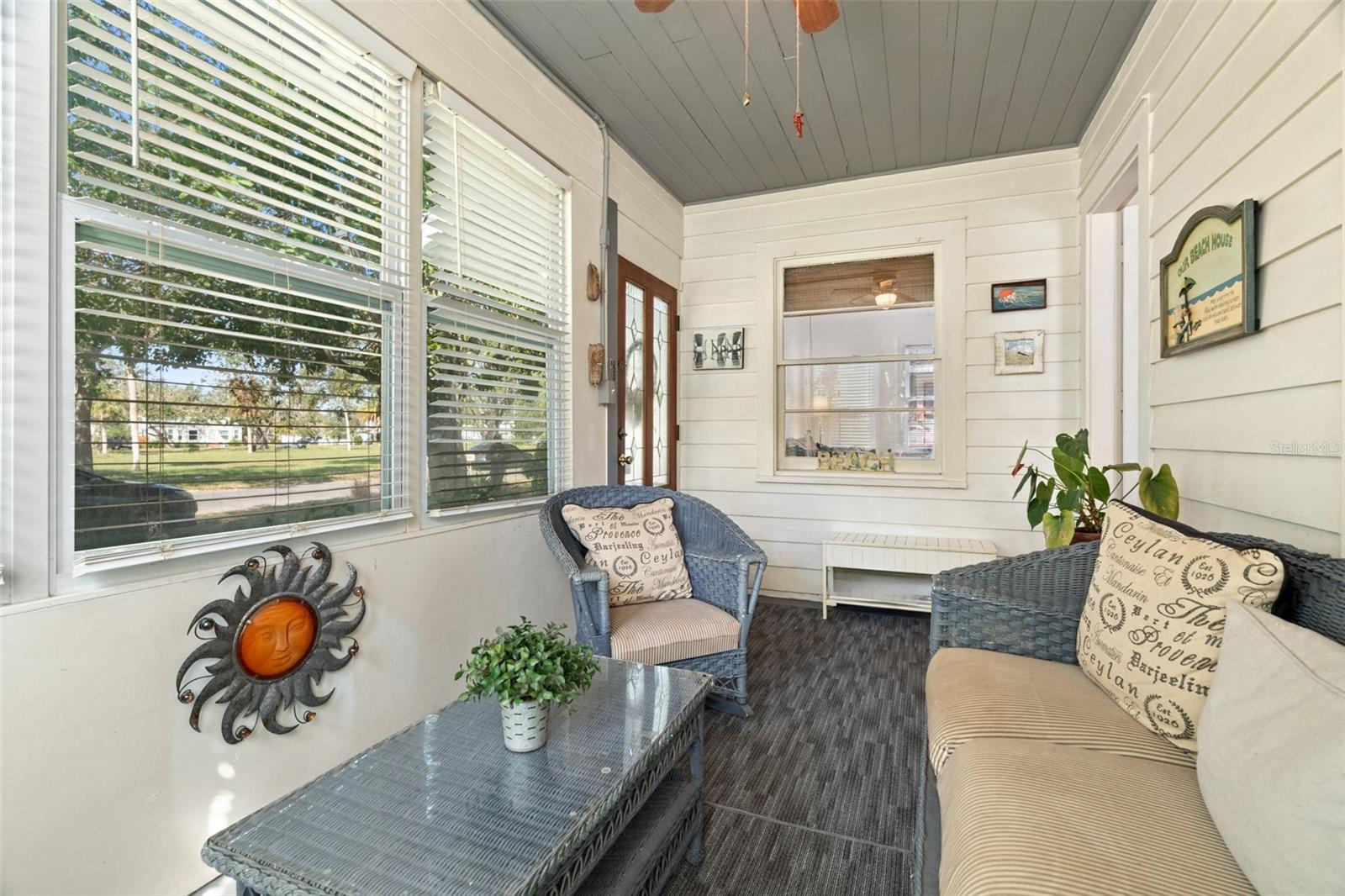 Enclosed front porch with views of Clymer Park