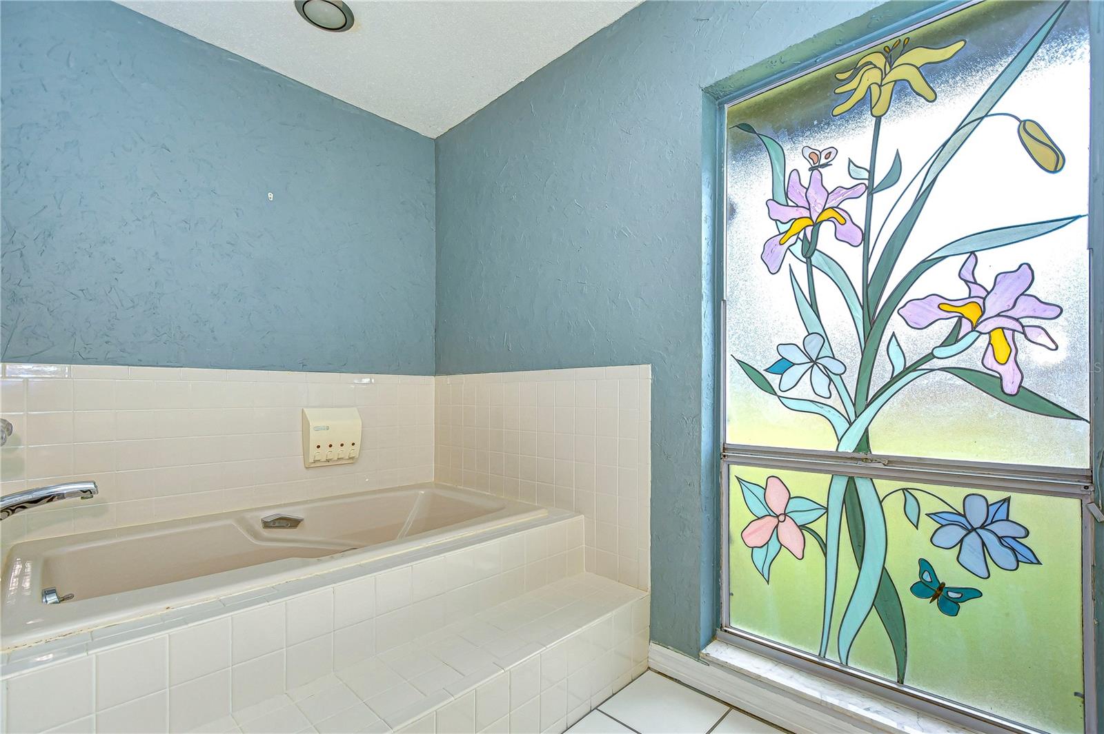 Soaking tub and stunning stained glass window!