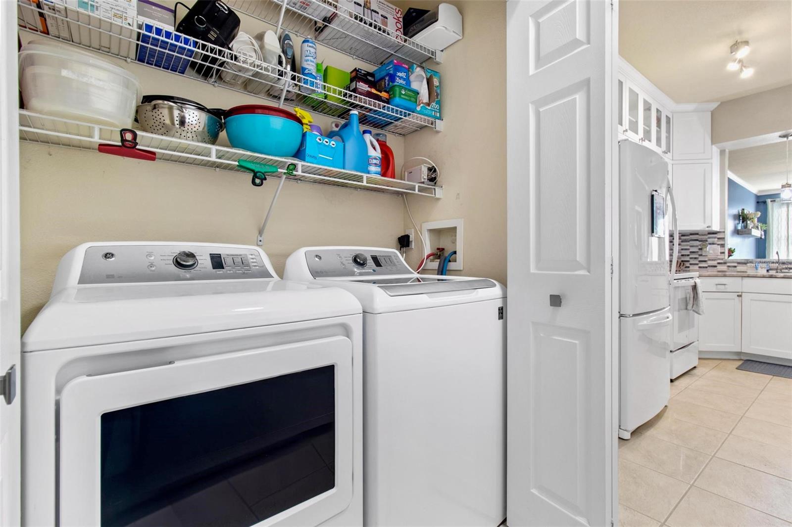 Garage entry to house with washer and dryer closet