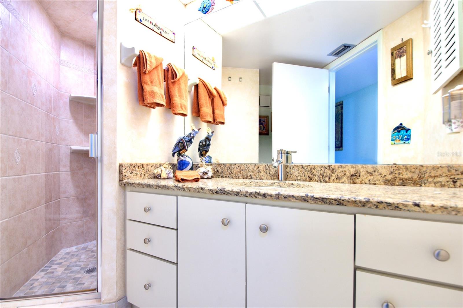 Walk in shower in 2nd/guest bathroom and ttub/shower combo in Primary Bathroom Suite.