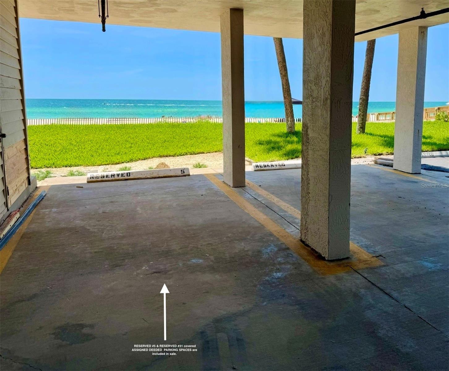 2 parking spaces deeded #05 under building (shown) and #31 under carport on South Side.