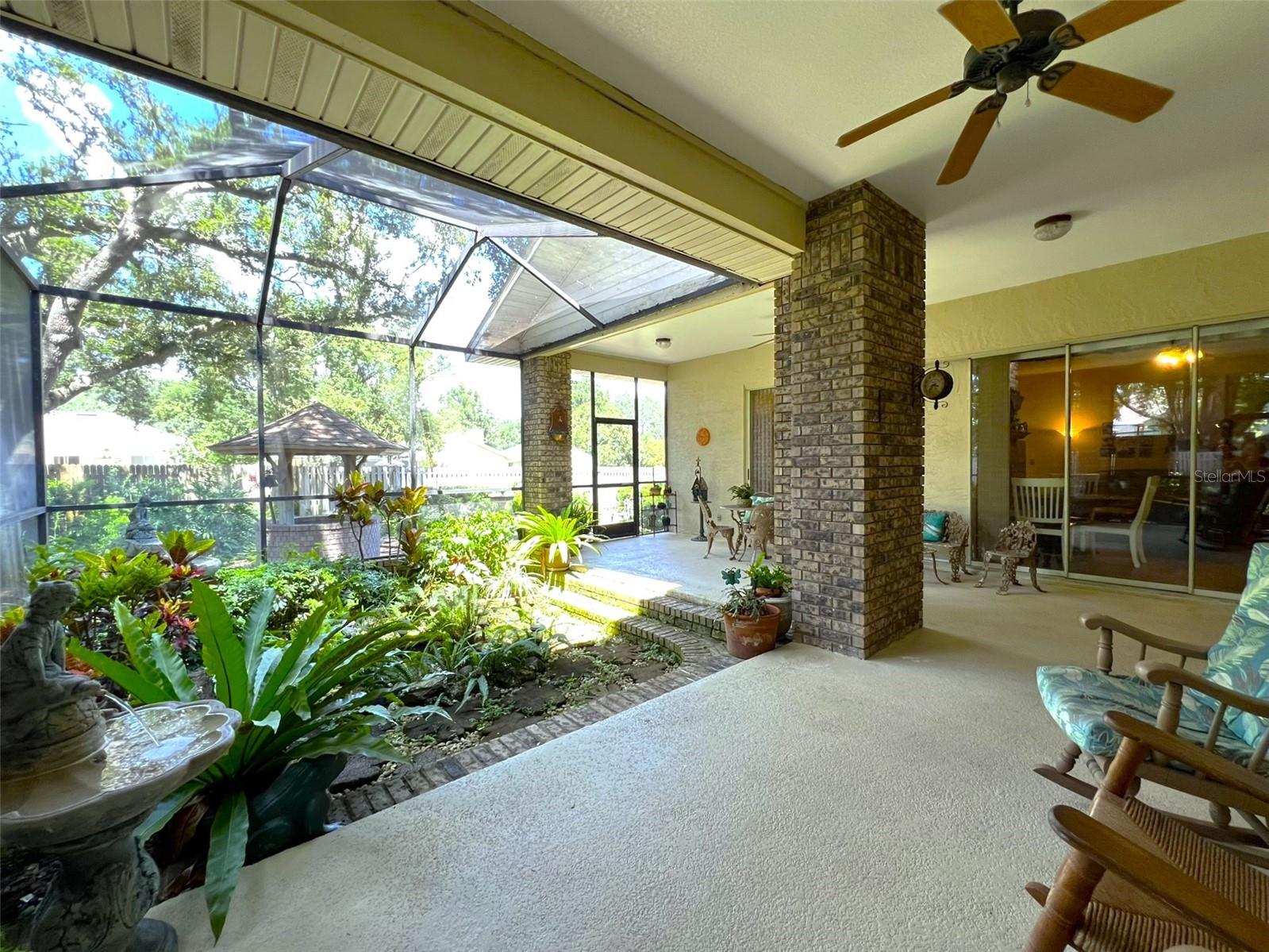 screened patio - notice the sunken garden and koi pond