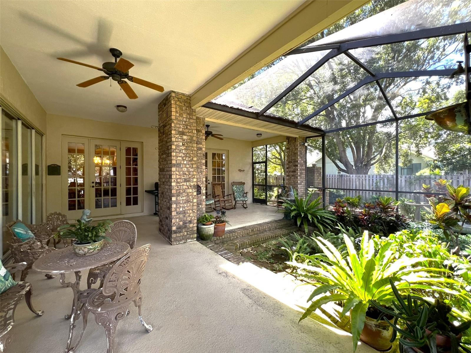 party-sized screened patio - notice fountain & small koi pond