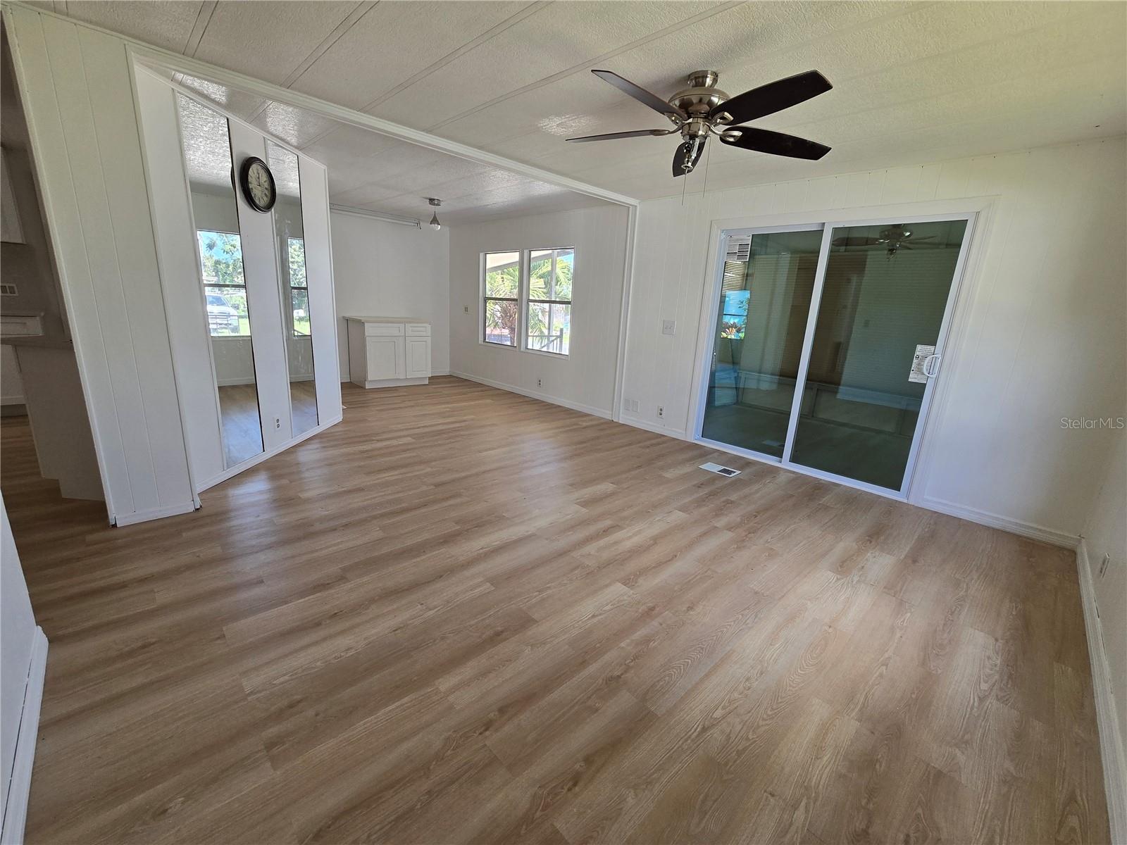 Living room towards enclosed porch and dining room