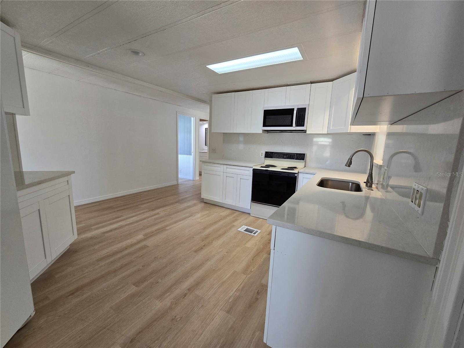 View of kitchen from door under carport as you walk in