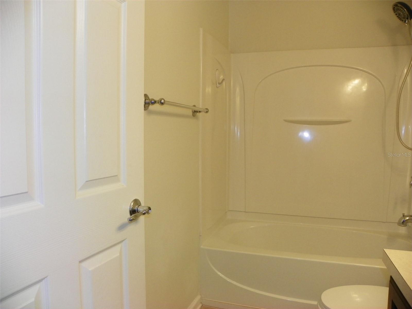 Guest Bathroom with door to additional entrance