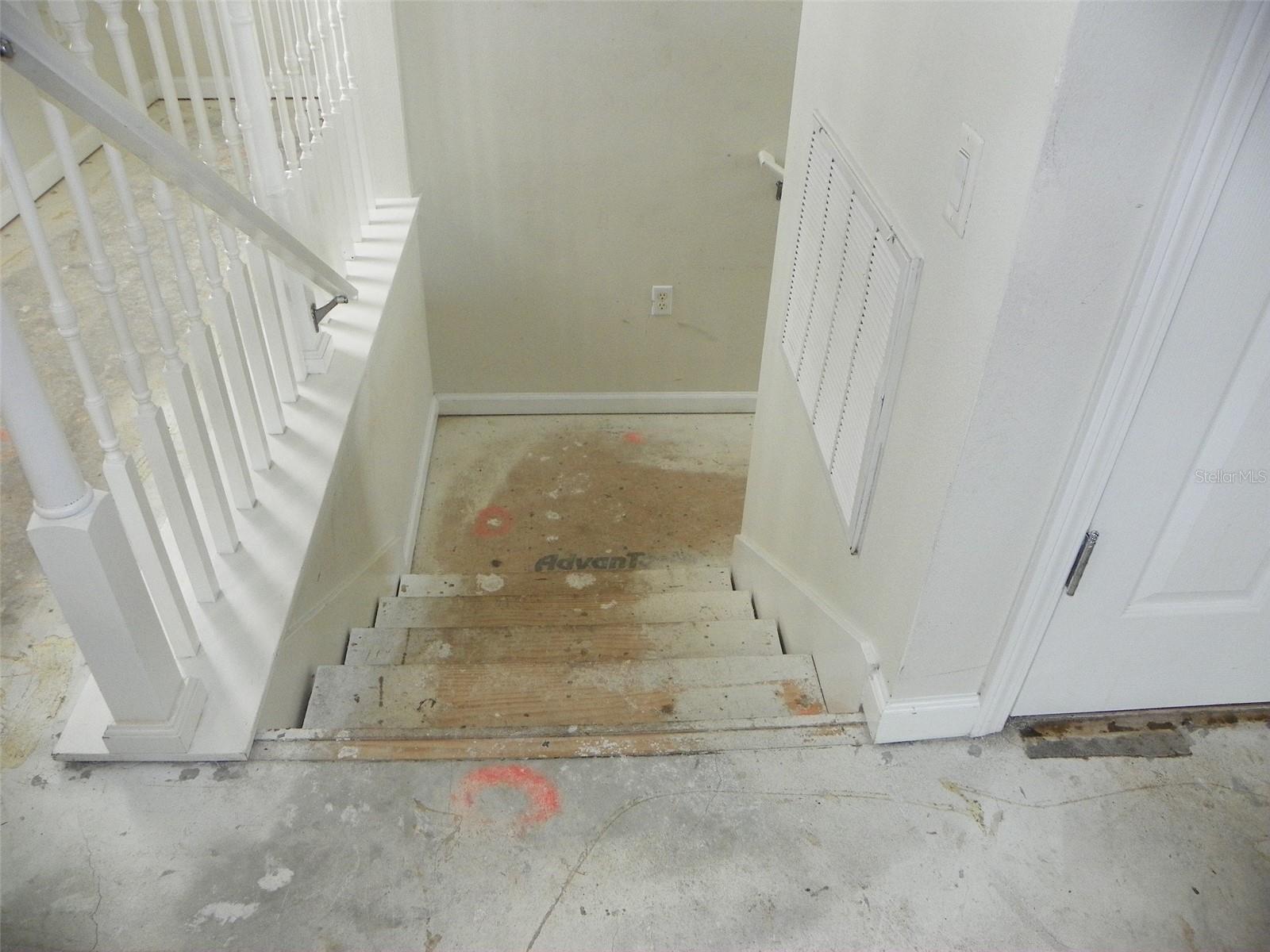 Stairs down to entrance and to garage