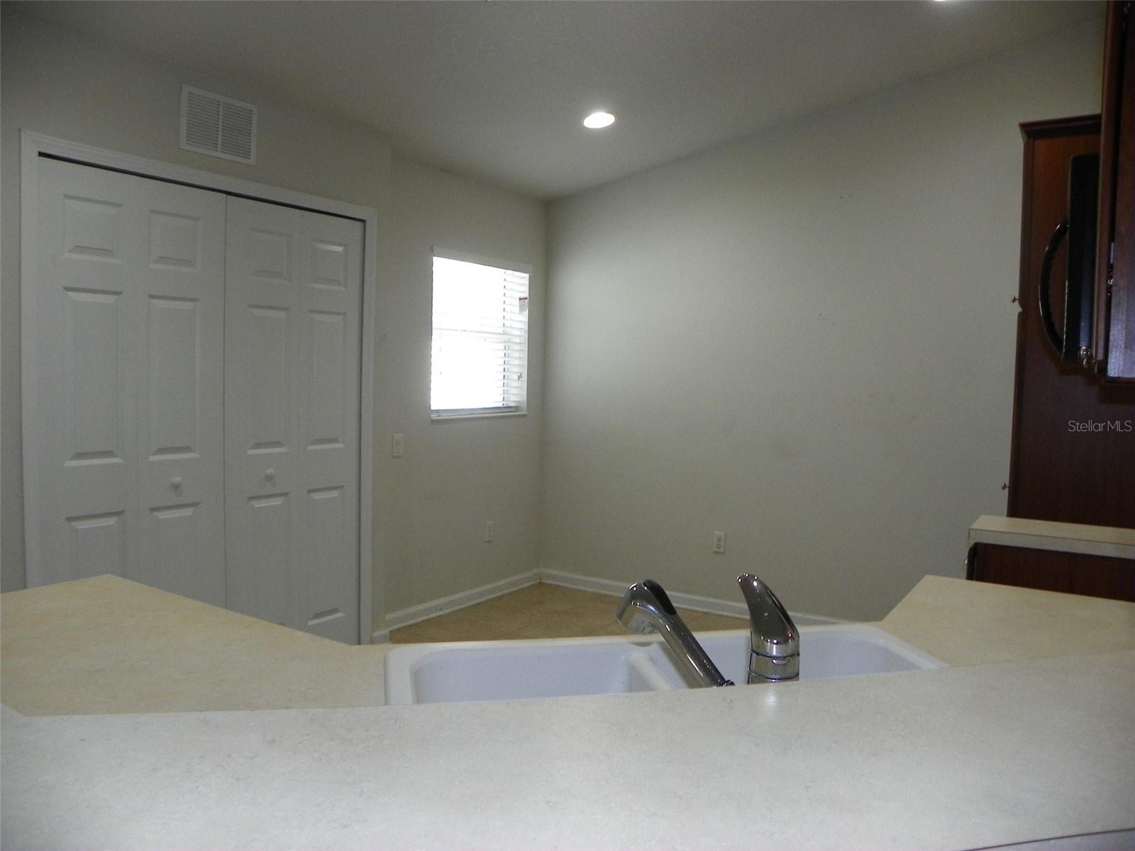 Kitchen bar, doors to the left is the washer/dryer