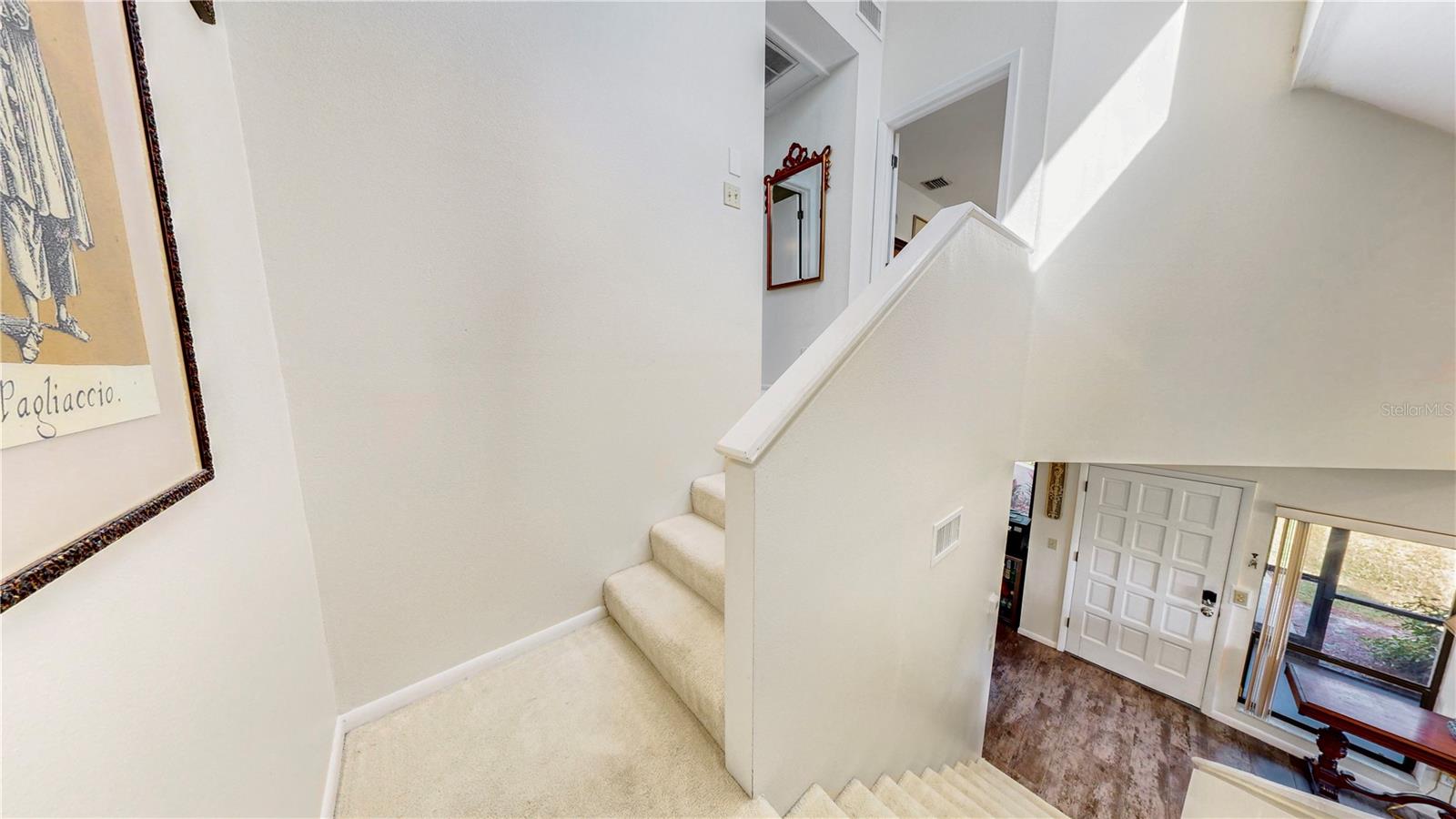 Staircase to the upstairs bedrooms and full bath. Both bedrooms have large walk in closets!