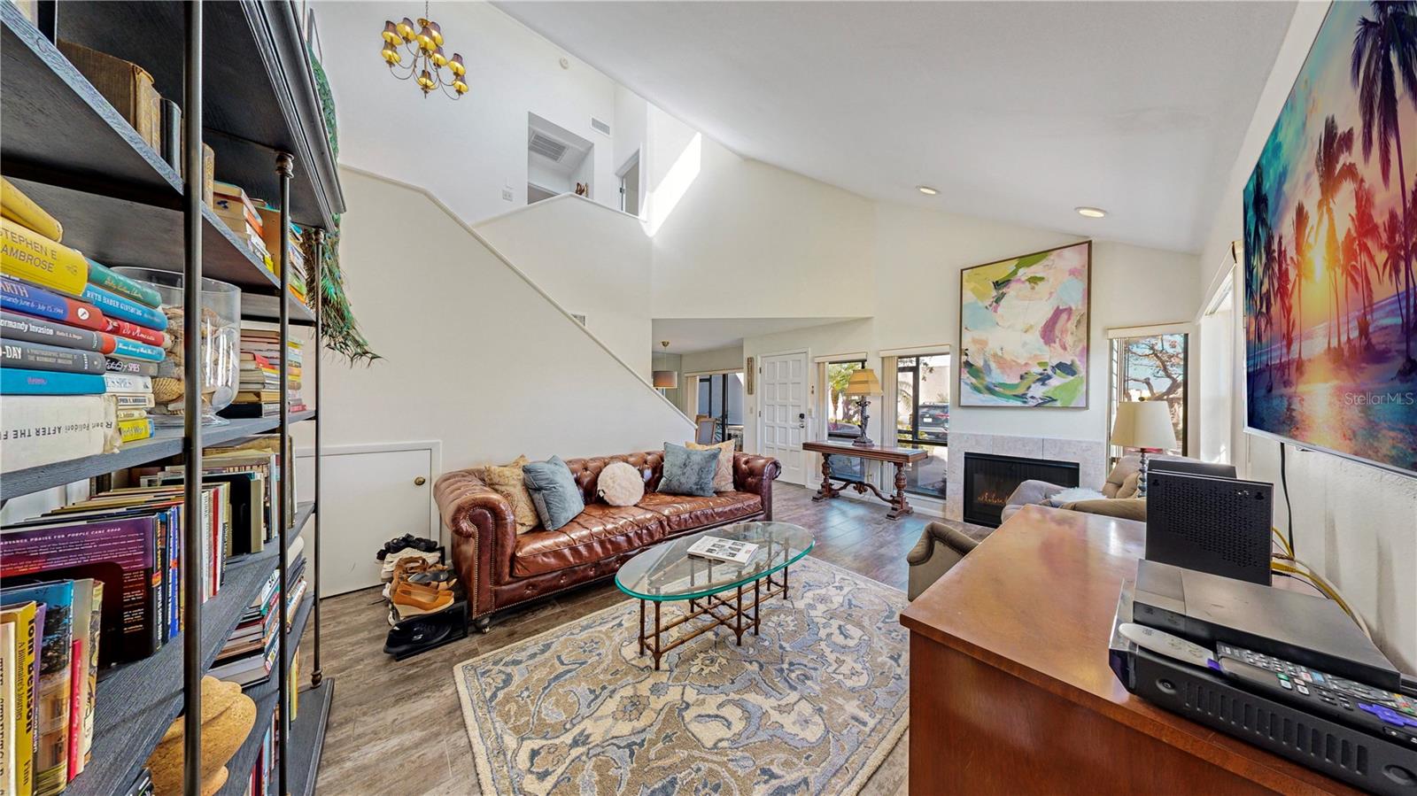 Looking towards the front door and the fireplace.