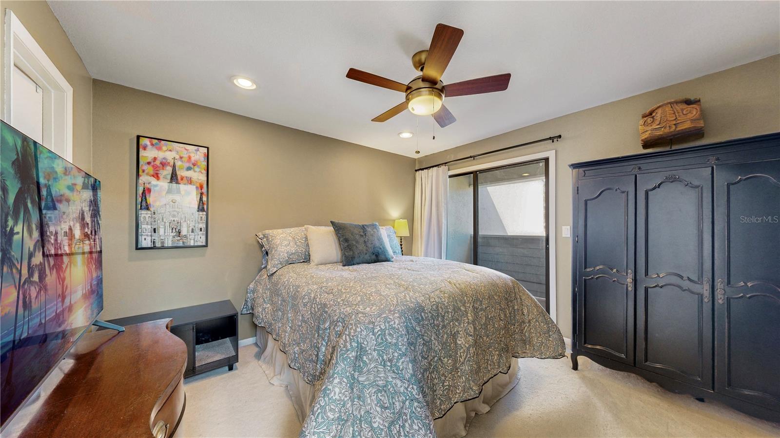 This lovely bedroom has a spacious walk in closet, newer ceiling fan and private balcony!