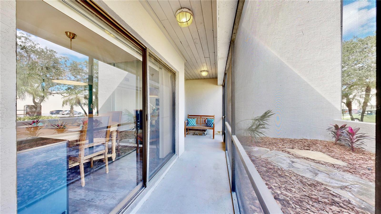 The screened porch runs the full length of the townhouse and accesses  the living room, the dining room and the kitchen.  Open this up on those great fall days!