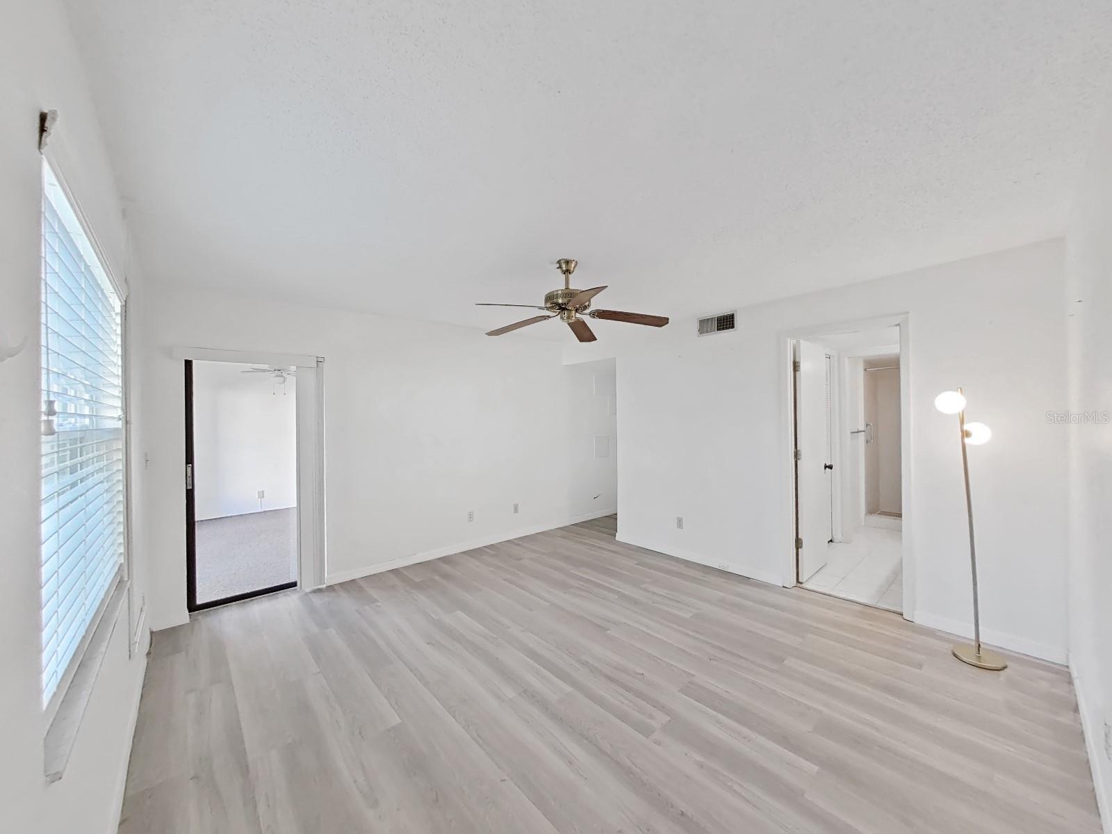 Master Bedroom with sliding glass door to covered patio.