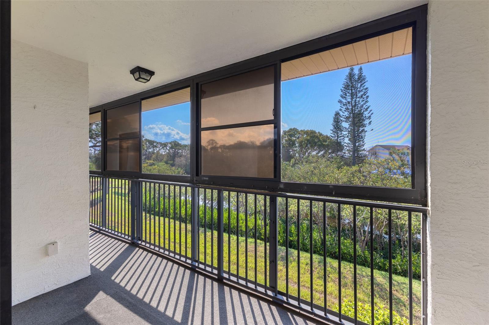 Private, screened balcony with canal views