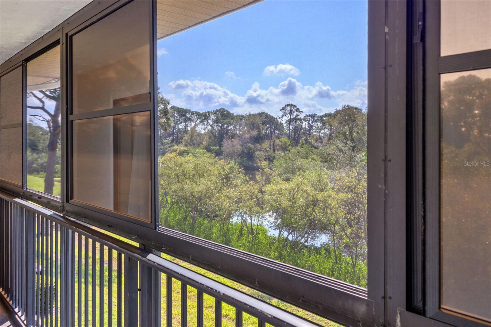 Private, screened balcony with canal views