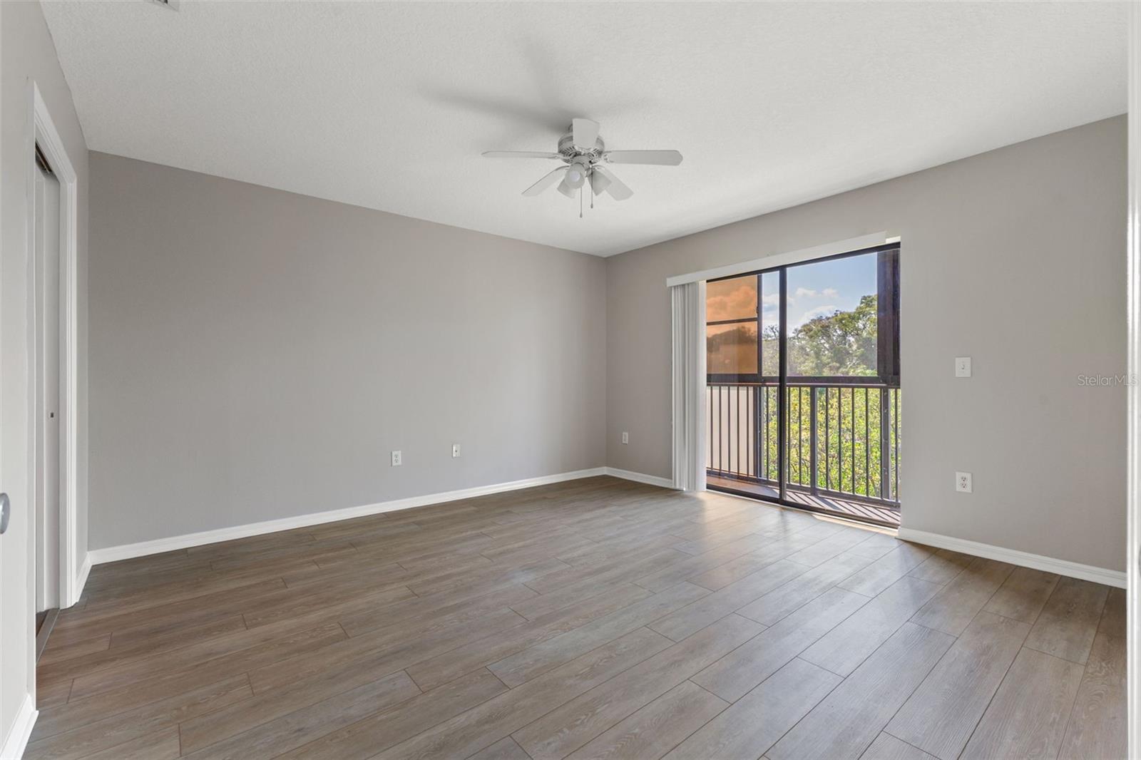 Primary Bedroom with access to screened balcony