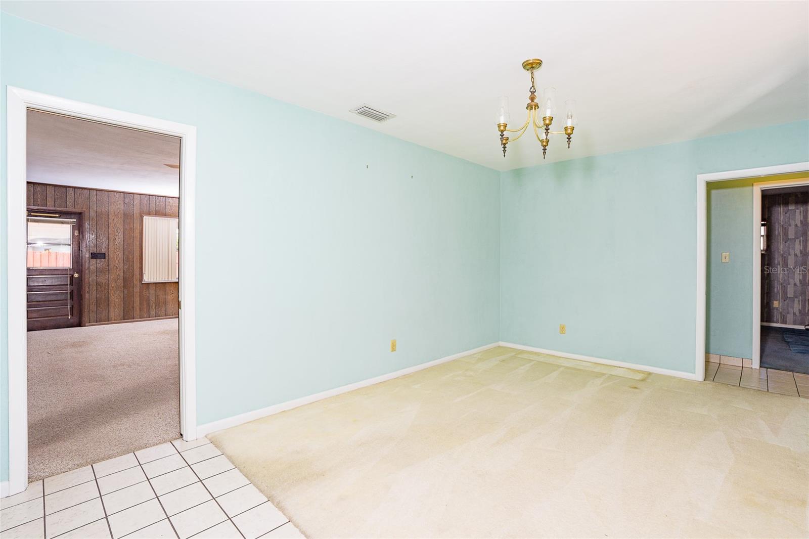 Entryway with view to eat in kitchen and living room