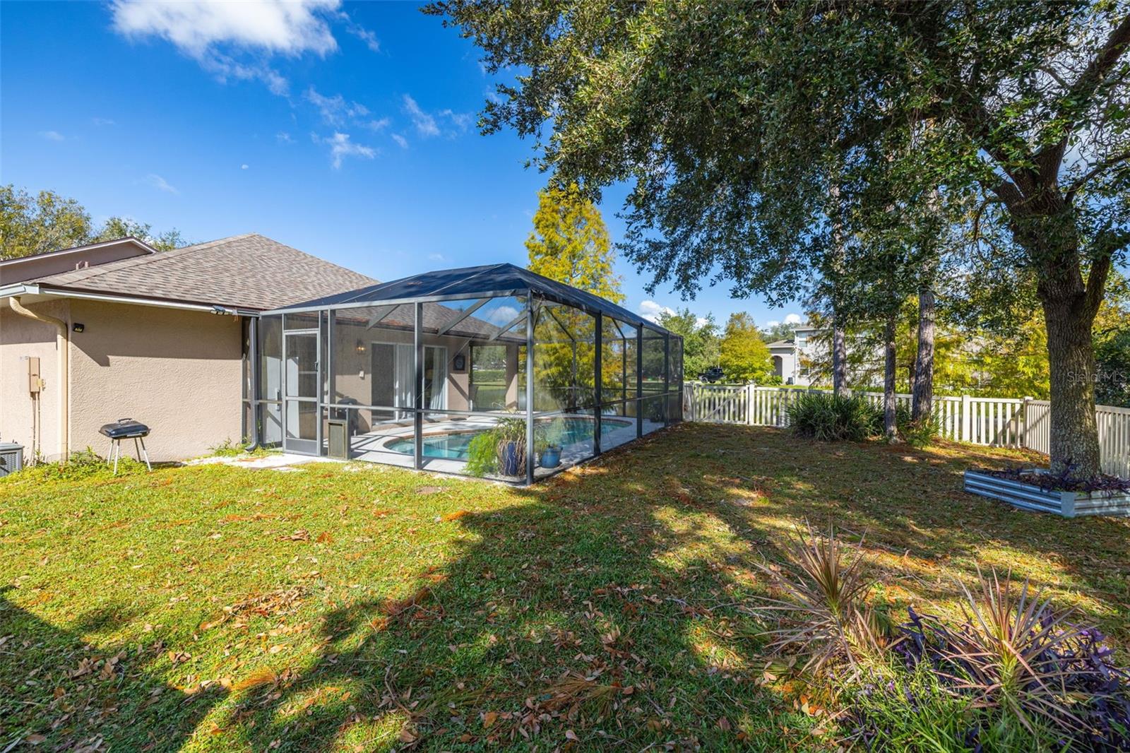 This oversized lot also has a nice area for pets or playing beyond the screened lanai.