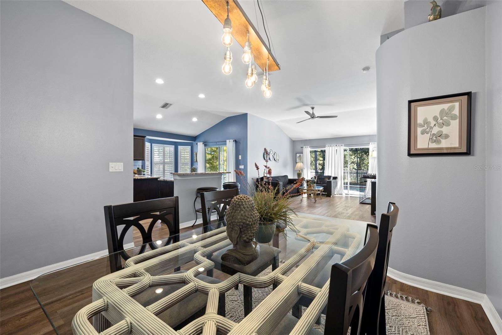 This home is bright with natural light from two sets of sliding doors leading out to the screened in lanai and pool.