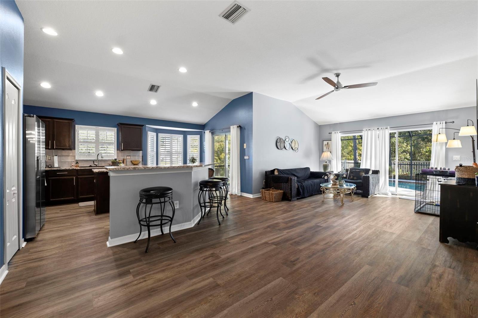 A gourmet kitchen awaits with tons of storage and granite counters. A breakfast bar provides ample extra seating options for casual dining.