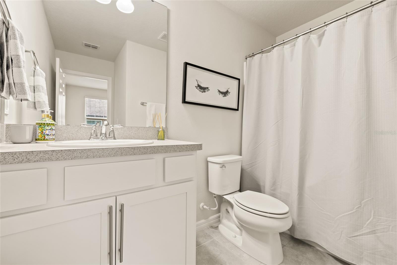 Upstairs full bathroom with tub