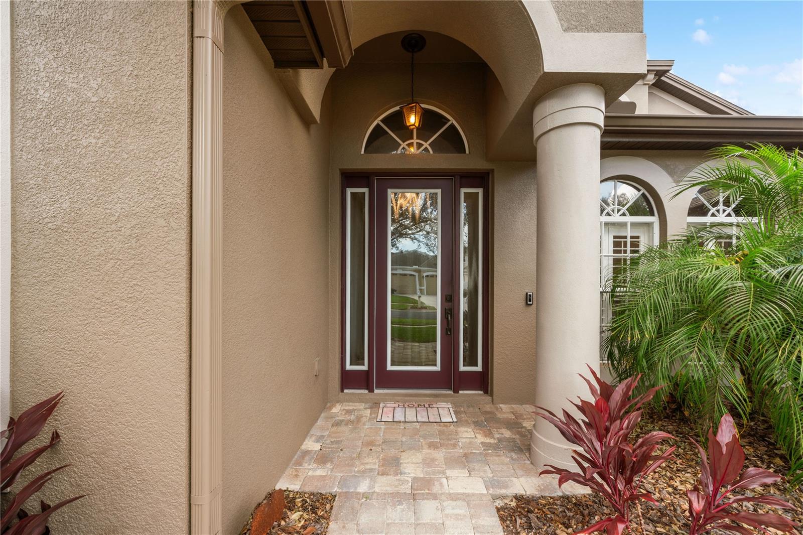 Charming entry with paver stone walkway