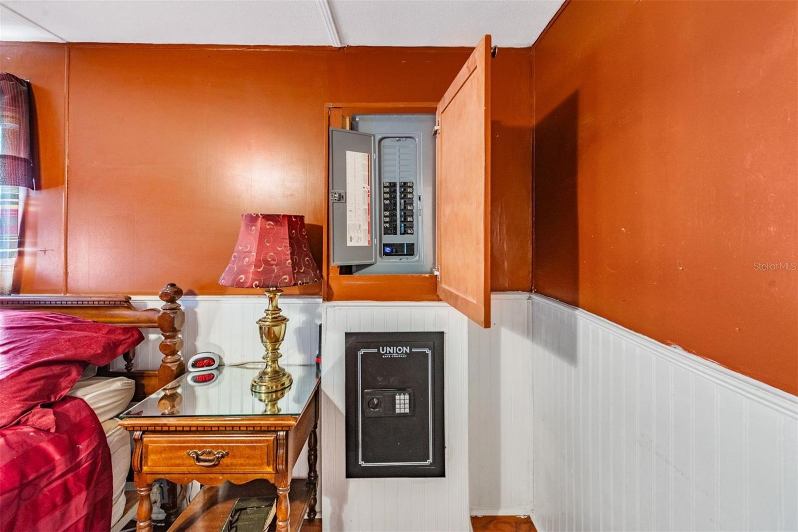 Primary bedroom with a wall safe.