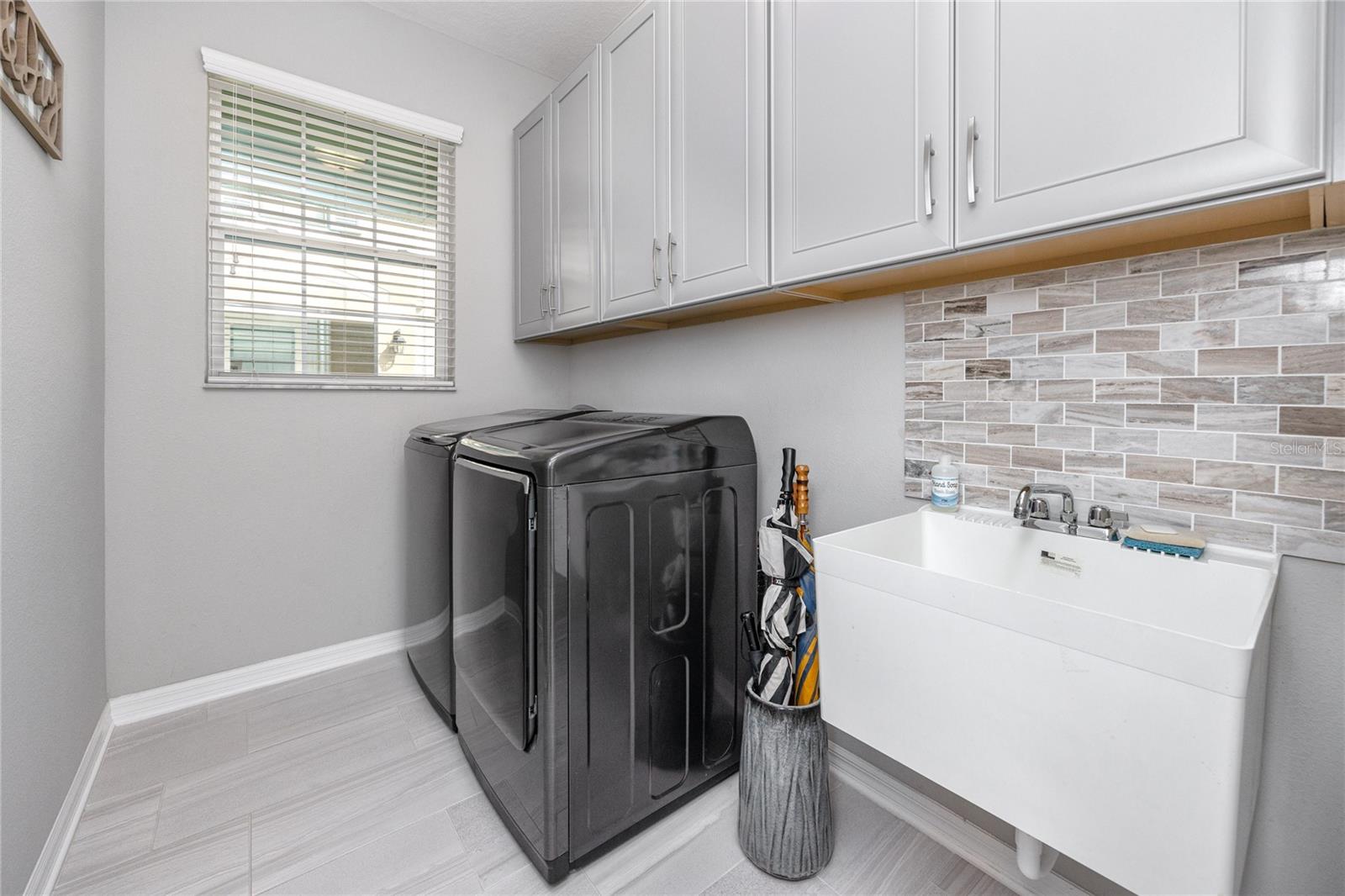 Laundry Room with Utility Sink and Plenty of Storage