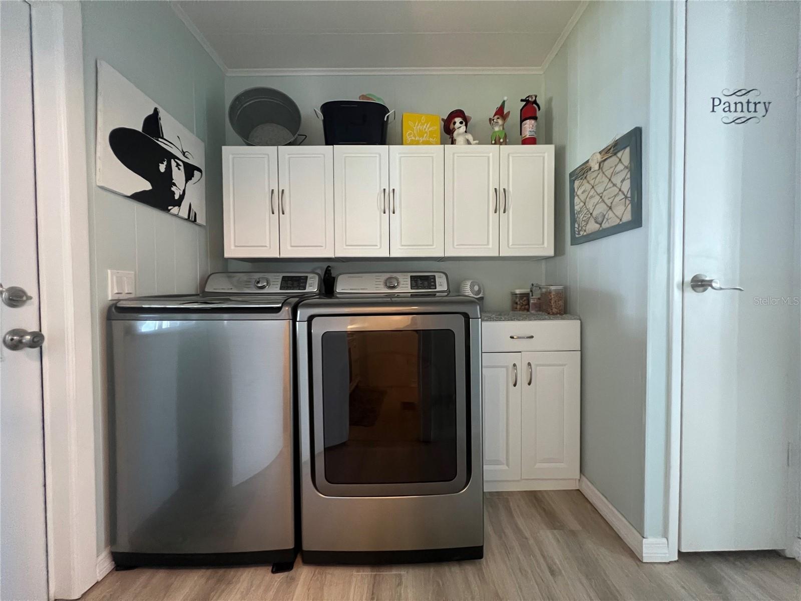 inside Laundry room with newer washer and dryer