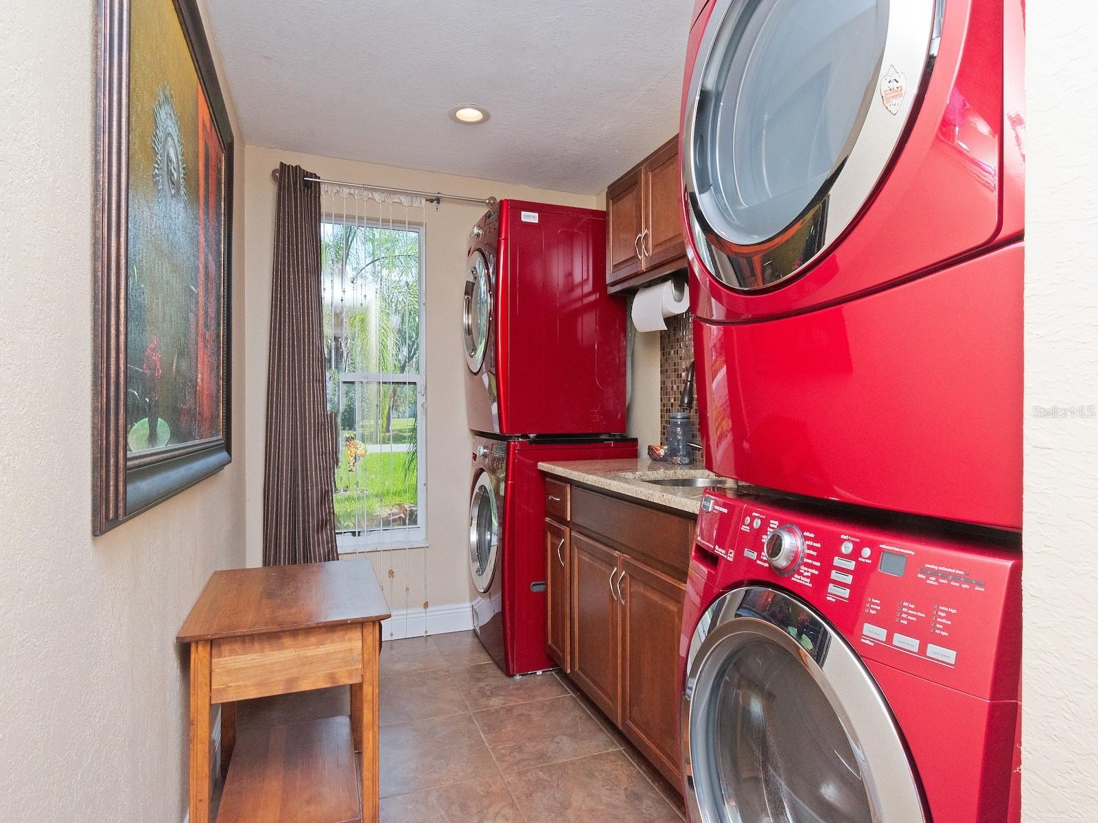 Double washer and dryer in large laundry room