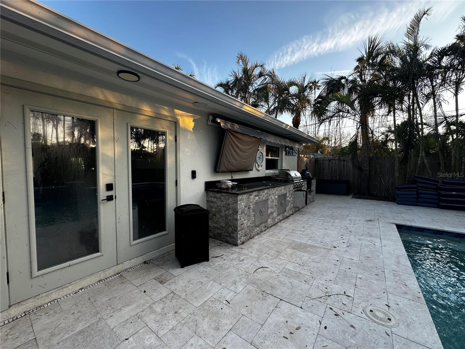 Office space back door and outdoor kitchen