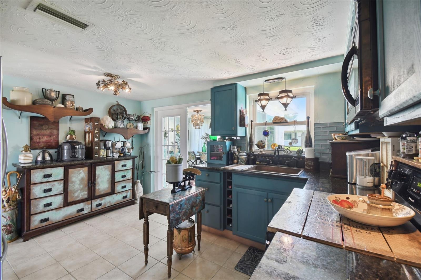 The credenza and wall shelves stay!